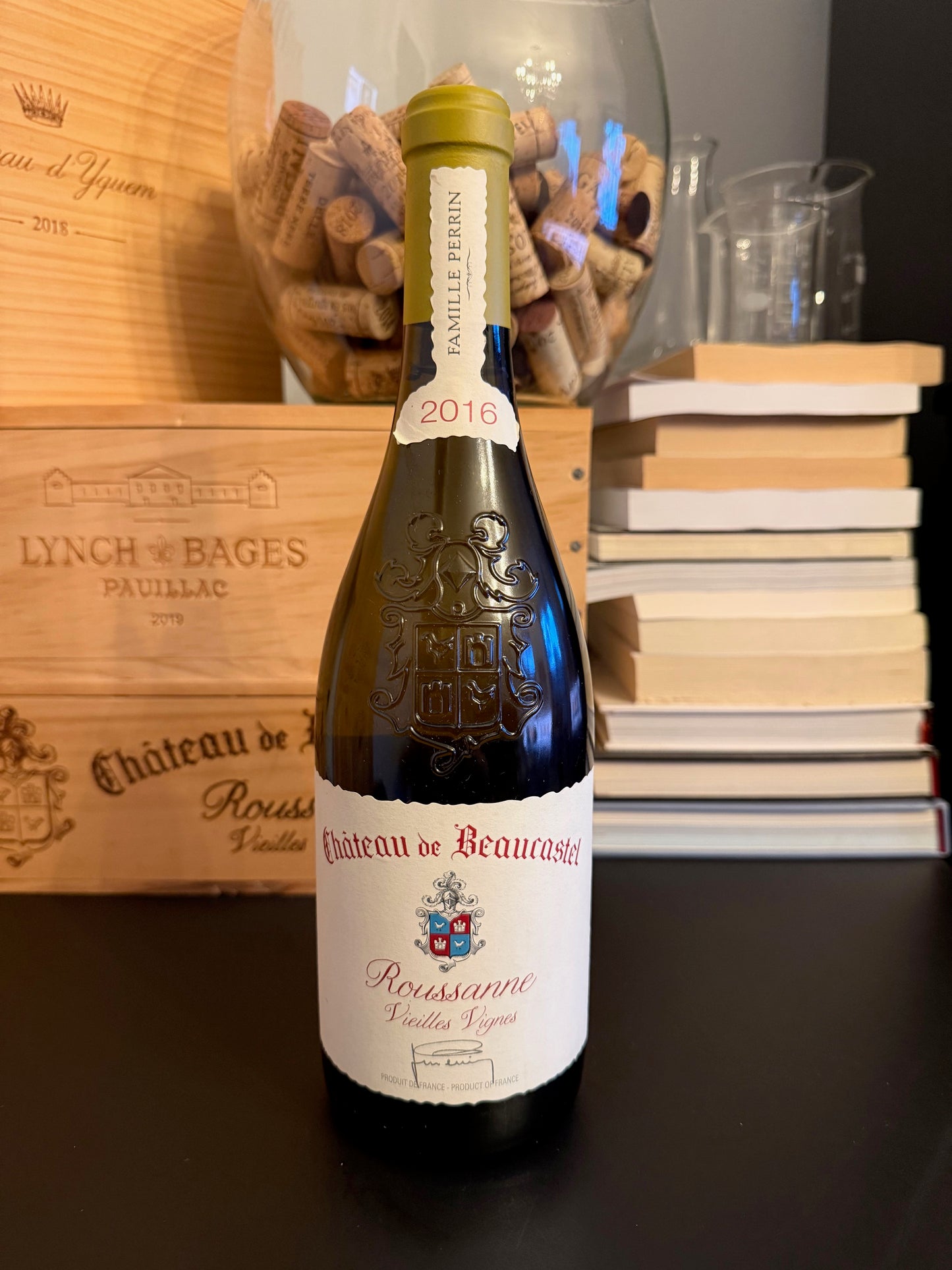 Wine bottle of Château de Beaucastel Roussanne Vieilles Vignes 2016 and wooden boxes.